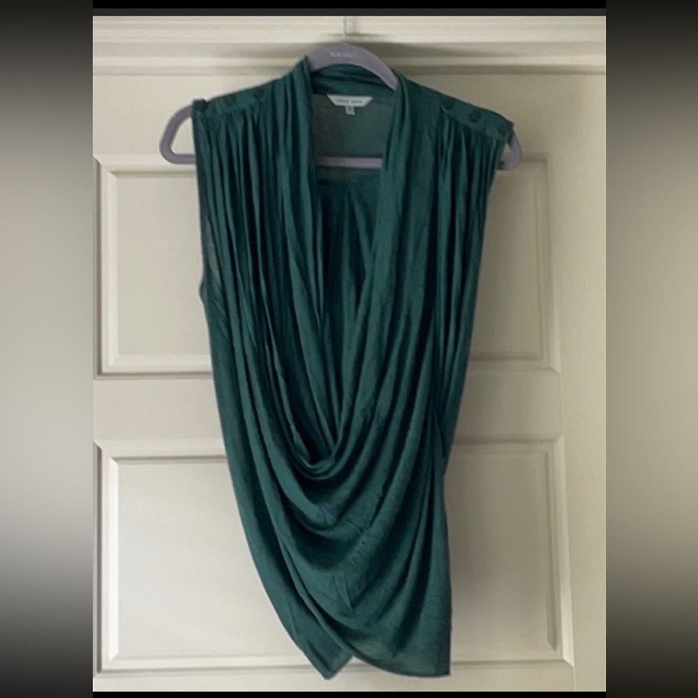 This is a forest green drape top that goes over a cami.